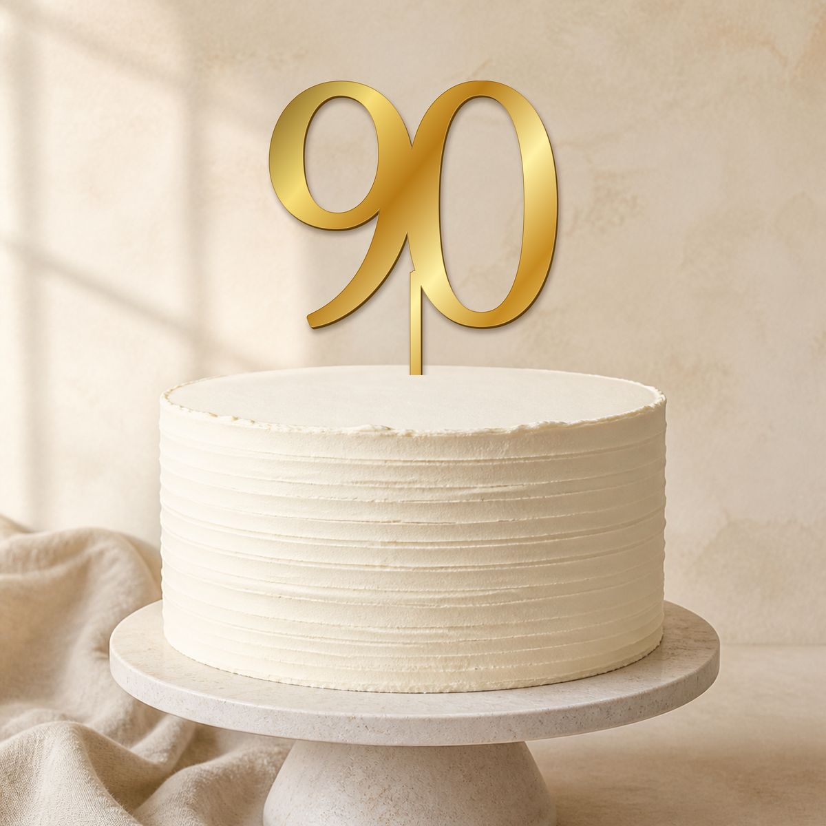 90 Gold Mirror Acrylic cake topper displayed on a cake
