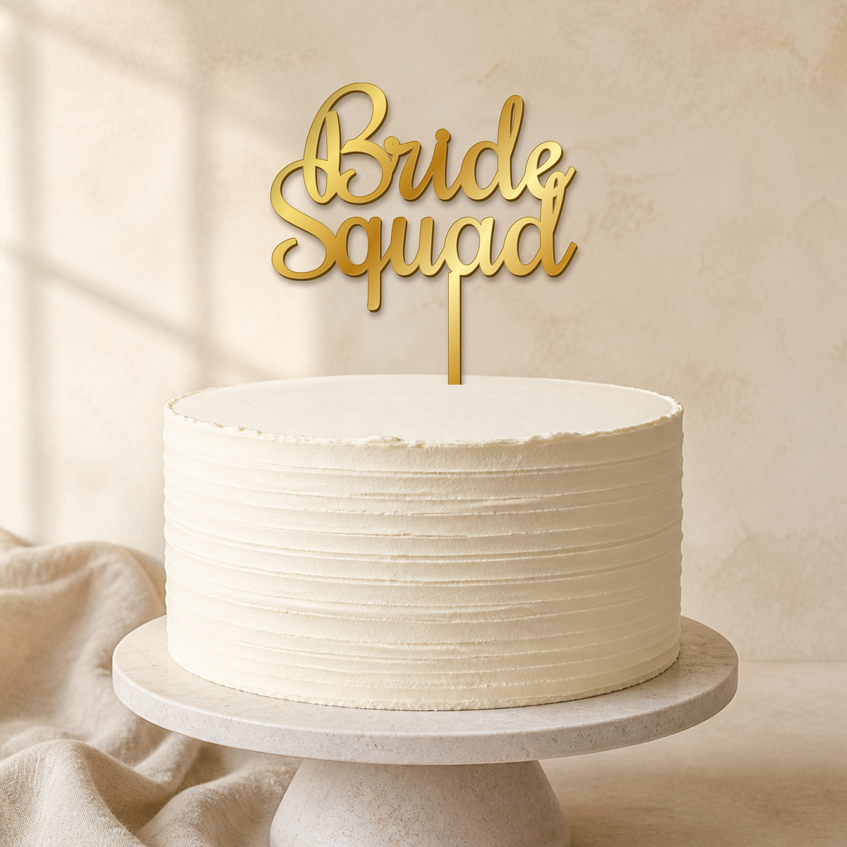 Bride Squad Gold Mirror Acrylic cake topper displayed on a cake