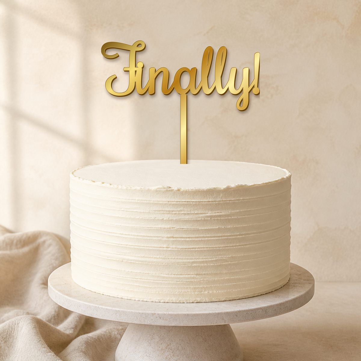 Finally Gold Mirror Acrylic cake topper displayed on a cake