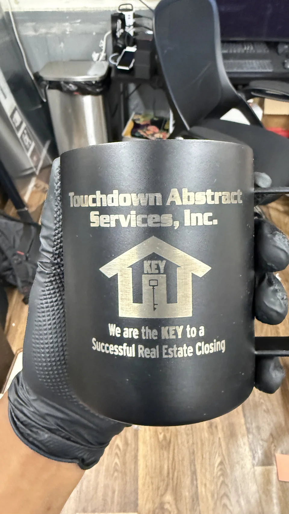 Custom business logo engraved on black drinkware