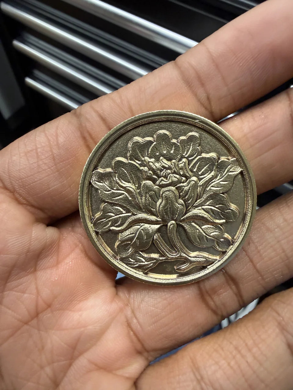 Detailed relief engraving on a metal coin